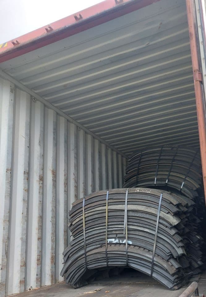 Baled truck and bus tyre casings loaded into a shipping container at the AP Rubber Group facility